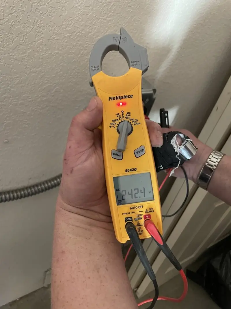 Voltage testing with clamp meter during Ceiling Fan Installation in Clarksburg